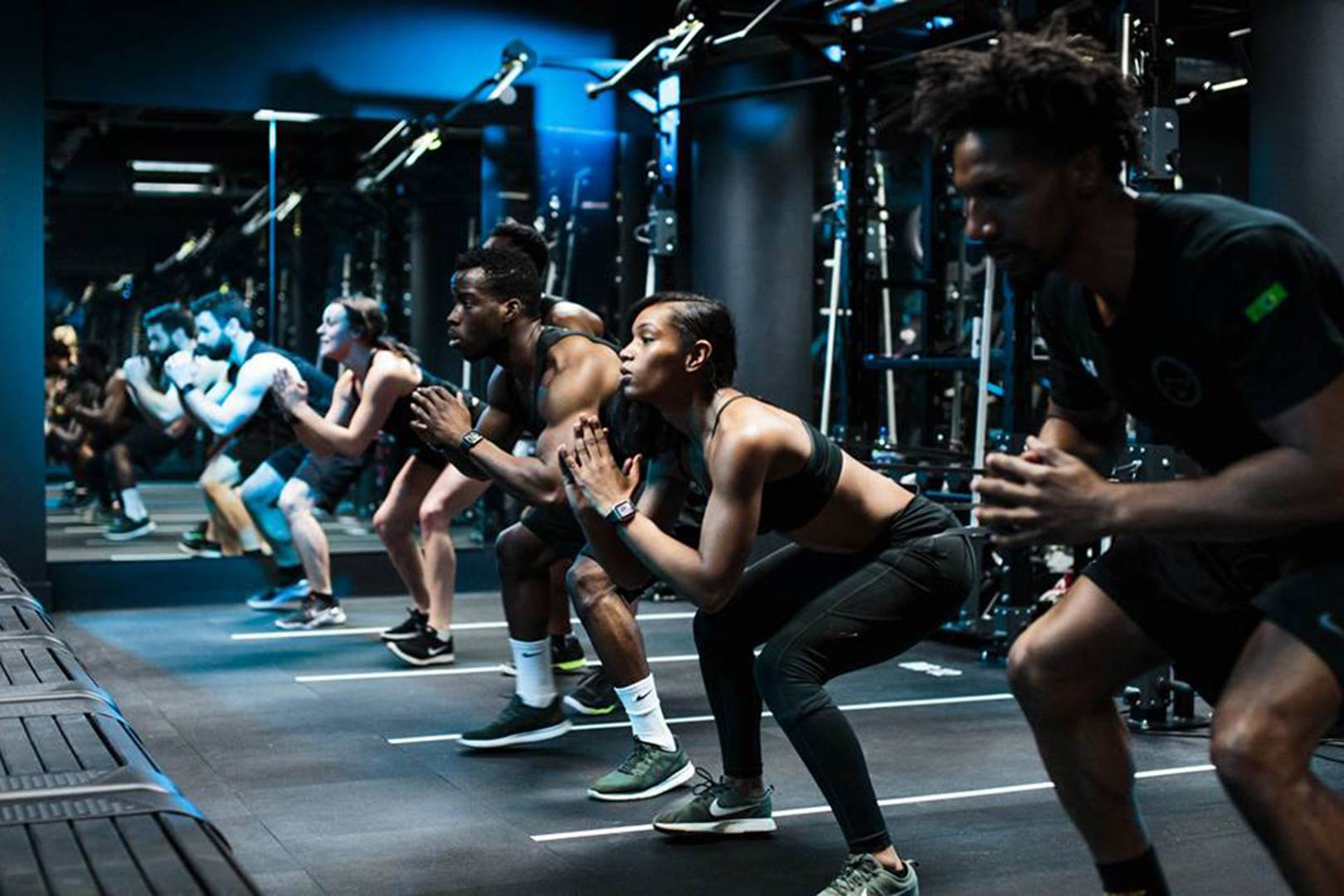 People doing group Squats. 